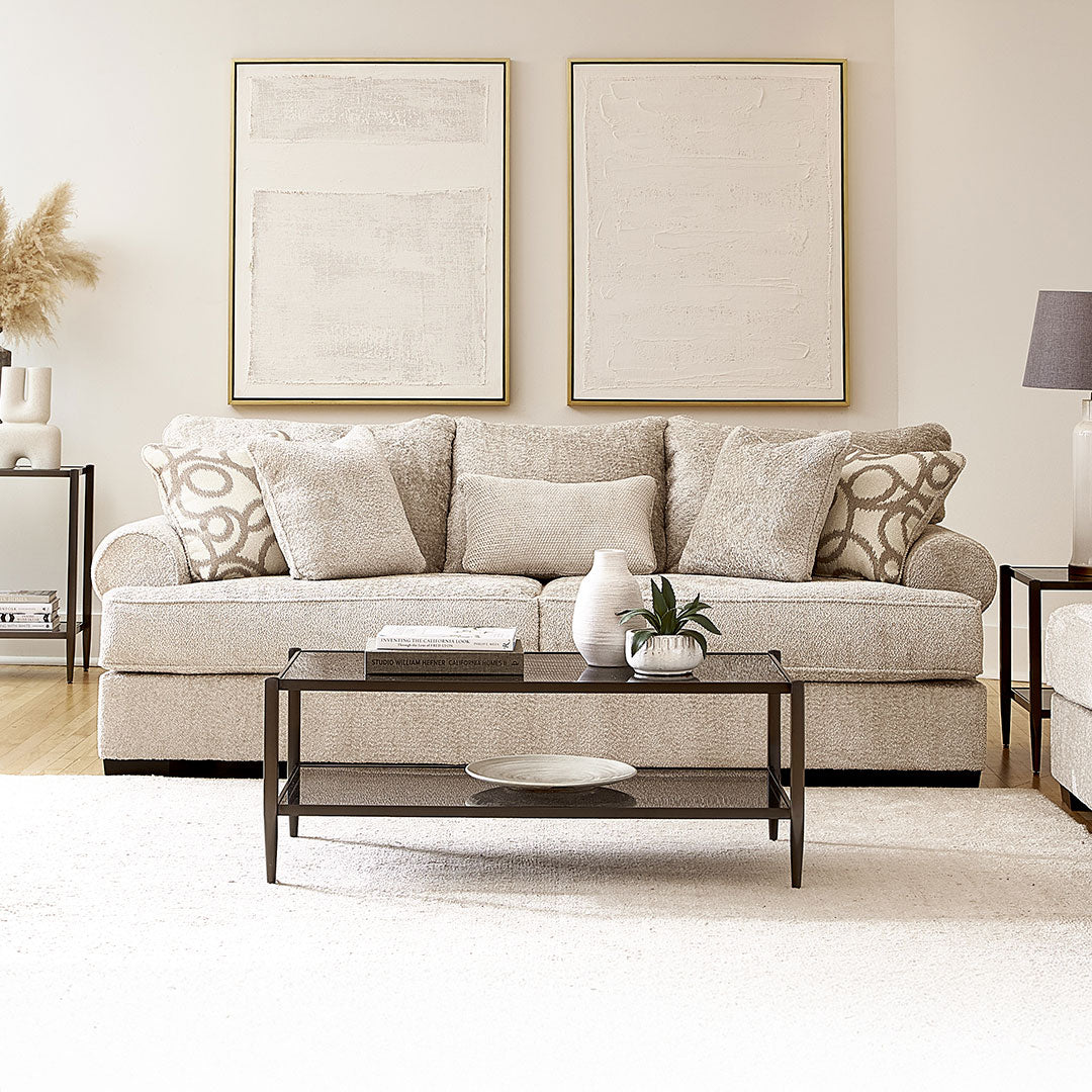 Living room with a made in usa beige sofa, coffee table, and decorative elements.