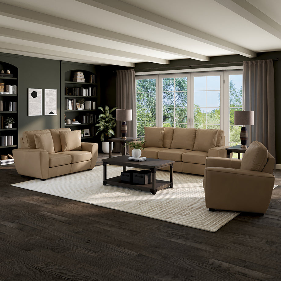 Floating living room seating group with sofa, loveseat, and accent chair centered on an area rug away from walls