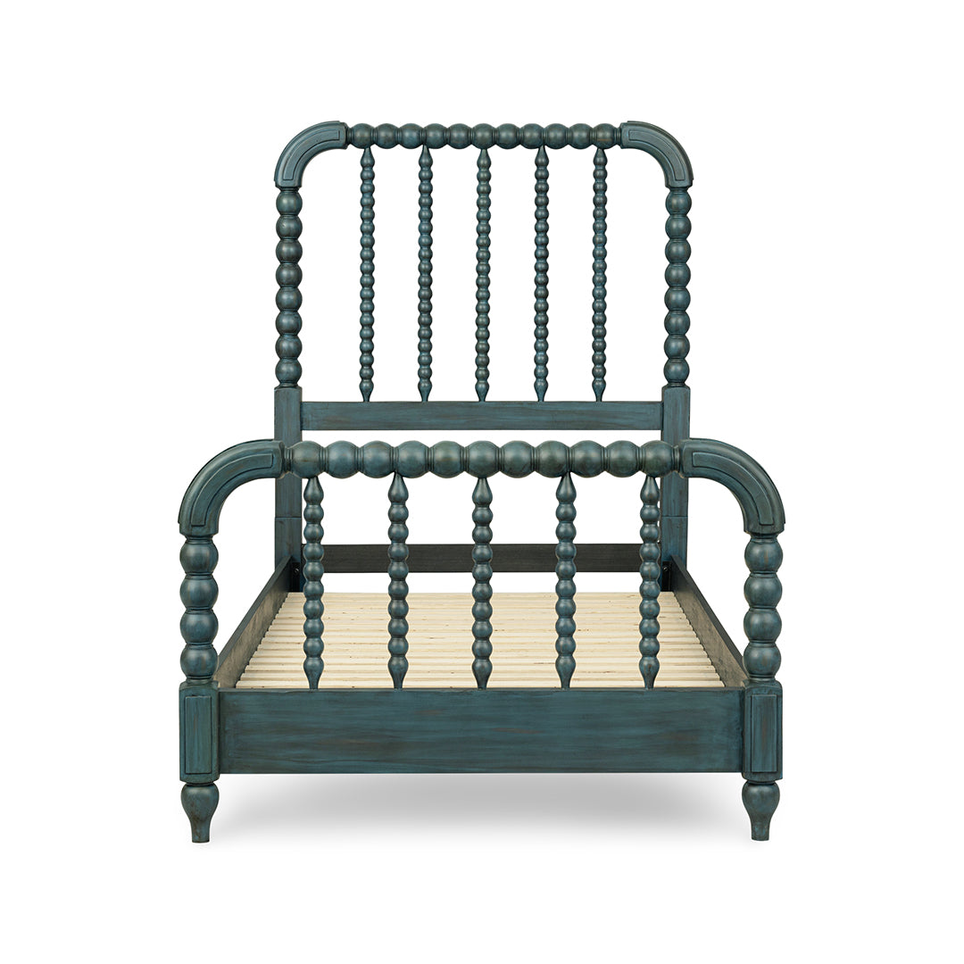 A dark teal painted wooden bed frame with a spindle-back headboard and footboard.