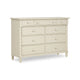 An off-white painted wooden dresser with six drawers, featuring decorative turned legs and round knobs.