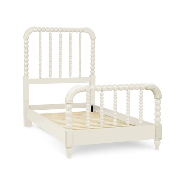 A single bed frame with a spindle headboard and footboard in an off-white finish.