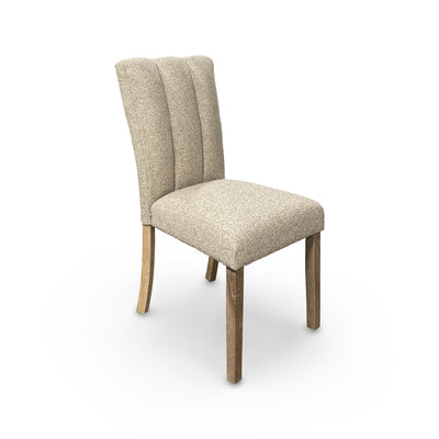 Beige upholstered chair with wooden legs on a white background
