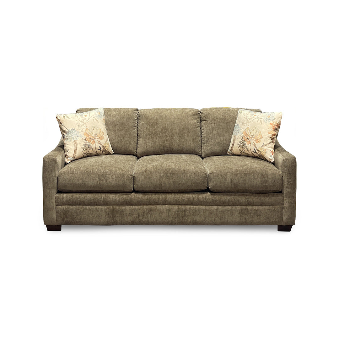 Brown sofa with floral-patterned cushions