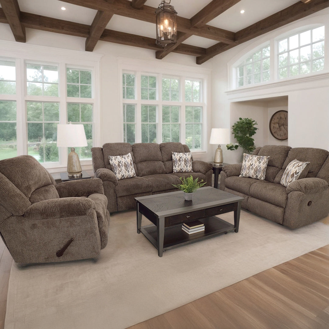 Living room with brown sofas, coffee table, and decorative items.