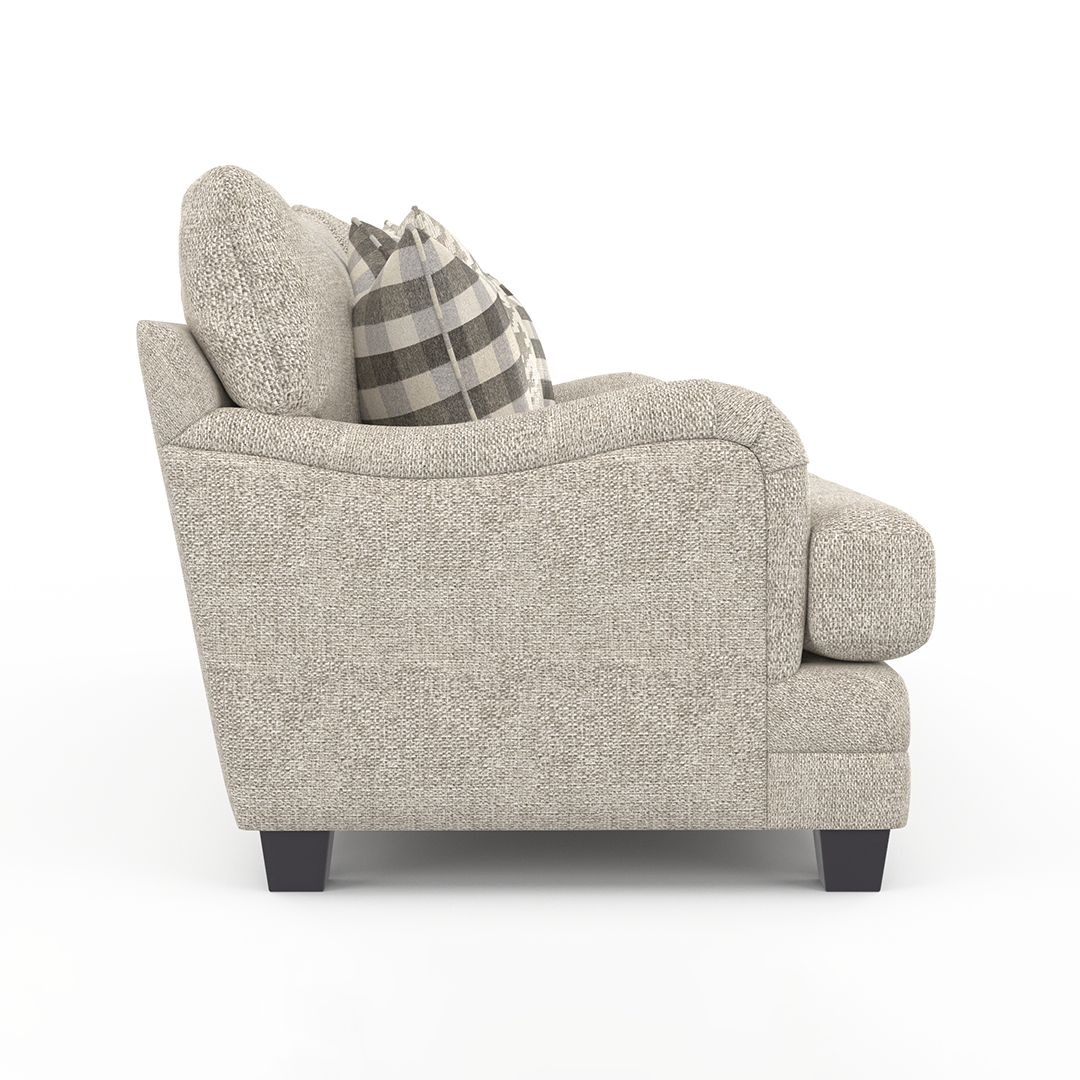 Beige armchair with a plaid pillow on a white background