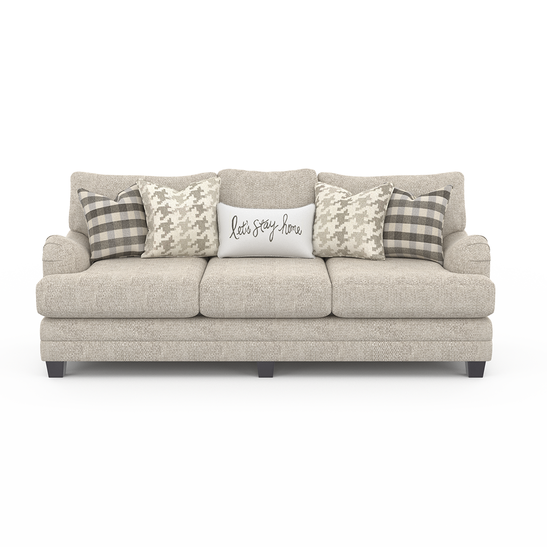 Gray sofa with decorative pillows on a white background