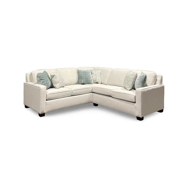 Beige sectional sofa with printed accent pillows