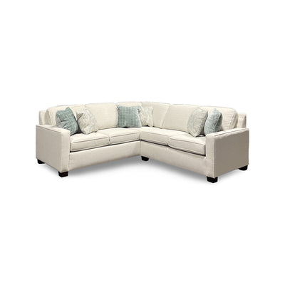 Beige sectional sofa with printed accent pillows