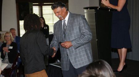 Anthony Muñoz Foundation event handshake ceremony