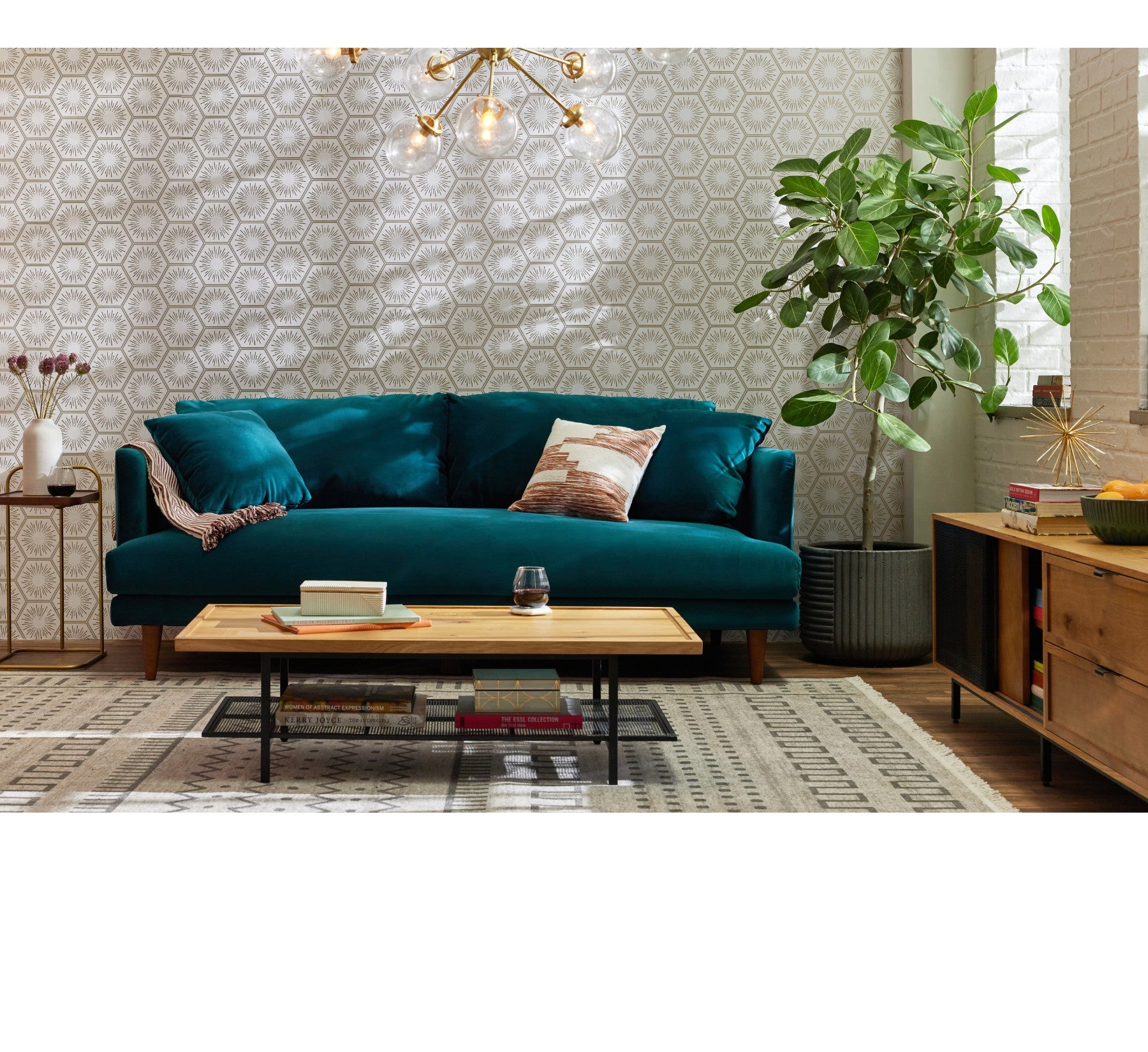 Teal Joybird sofa with brass accents