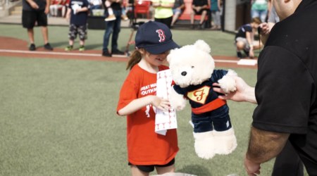 Joe Nuxhall Miracle League player with Super Eddie Bear