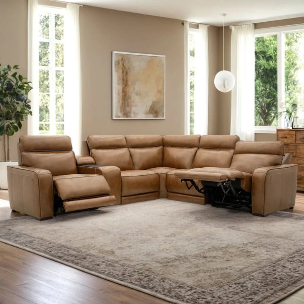 Moto Motion leather reclining sectional sofa in a bright living room with footrests extended