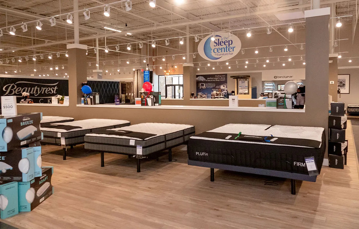 Showroom display of mattresses at Furniture Fair Sleep Center