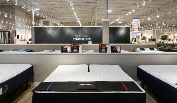 Tempur-Pedic display with Furniture Fair branded runner