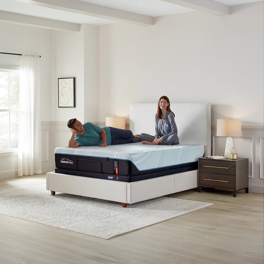 Couple on Tempur-Pedic mattress in modern bedroom