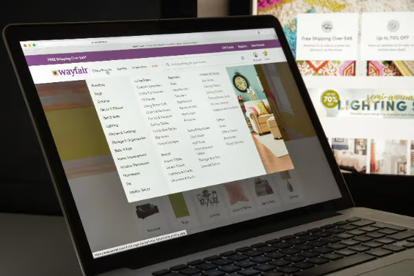 Wayfair website shown on a laptop with navigation menu open