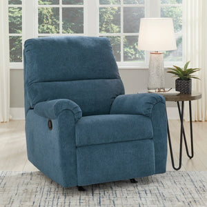 Miravel Manual Recliner by Ashley Furniture - A luxurious recliner in bold indigo upholstery with sleek design and ultimate comfort. Adjustable reclining positions for personalized relaxation. Enhance your space with this stylish and inviting recliner. Perfect for leisurely activities or unwinding after a long day.