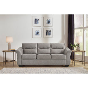The Miravel Sofa by Ashley Furniture in Slate - A sleek and stylish sofa with contemporary design. Upholstered in a stunning slate fabric, this sofa features clean lines and a comfortable seating arrangement. The soft slate color adds a touch of sophistication to any living space. With its plush cushions and sturdy frame, the Miravel Sofa offers both comfort and durability. Perfect for lounging or entertaining guests, this sofa is a perfect addition to modern home decor.