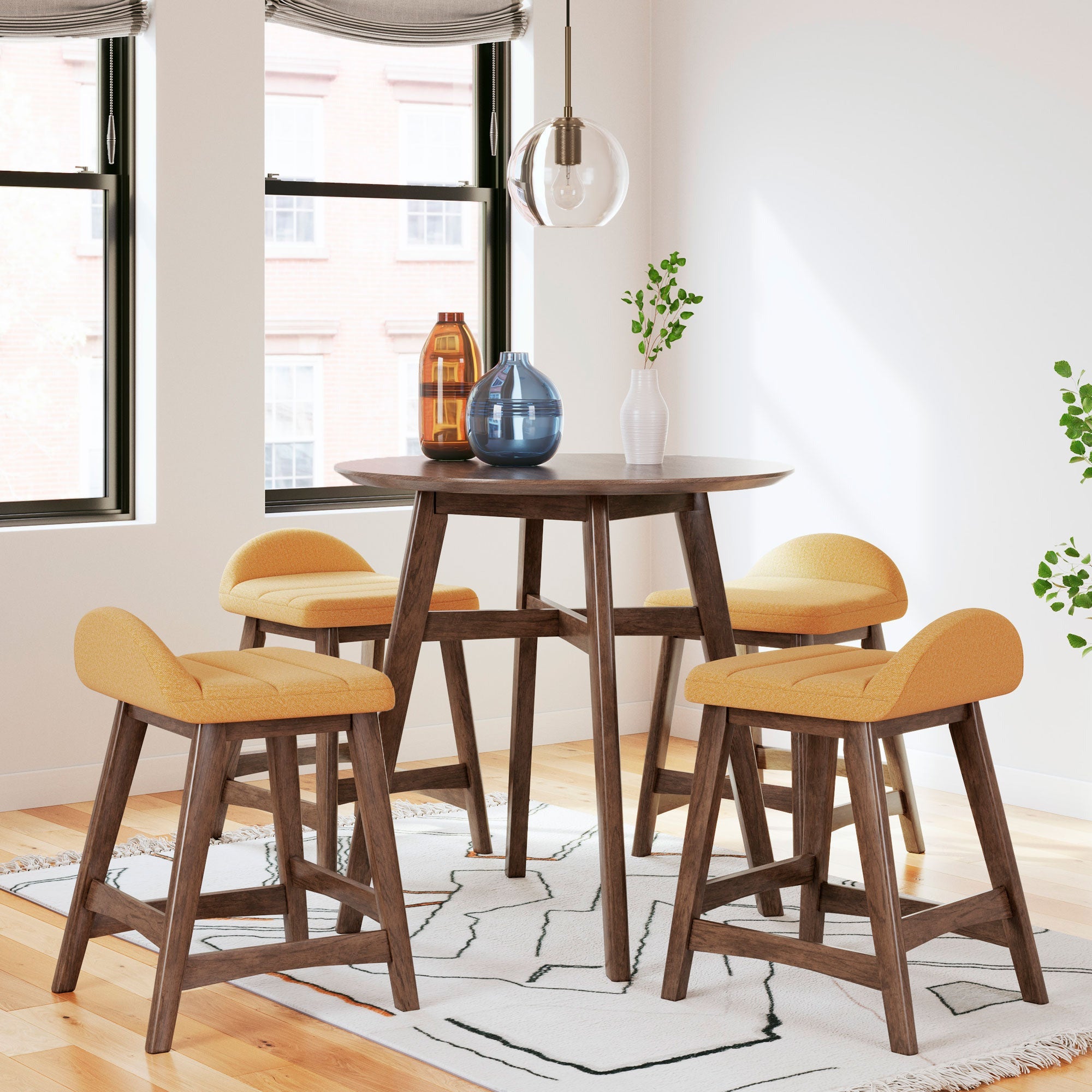Lyncott Counter Height Dining Set (Mustard) - Round counter height table in a medium brown finish with 4 counter height upholstered mustard stools featuring a matching medium brown finish on the wood legs.